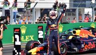 Red Bull's Dutch driver Max Verstappen gives his thumb up after securing his first ever pole position in qualifying of the Formula One Hungarian Grand Prix at the Hungaroring circuit in Mogyorod near Budapest, Hungary, on August 3, 2019. / AFP / Andrej IS