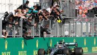 Mercedes' Lewis Hamilton and team celebrate winning the Hungarian Grand Prix REUTERS/Bernadett Szabo