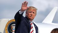 U.S. President Donald Trump waves as he boards Air Force One at Morristown municipal airport en route to Washington after a weekend in Bedminster, New Jersey, U.S., August 4, 2019. REUTERS/Yuri Gripas