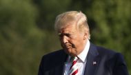 US President Donald Trump and First Lady Melania Trump (not pictured) return to the White House in Washington, DC, on August 4, 2019.  / AFP / Alastair Pike