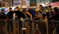 Demonstrators shout slogans at a group of people opposing the anti-government protesters, during a demonstration in support of the city-wide strike and to call for democratic reforms in Hong Kong, China, August 5, 2019. REUTERS/Kim Kyung-Hoon