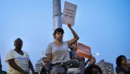 People attend a vigil for the victims of the recent mass shootings in El Paso, Texas and Dayton, Ohio, in Grand Army Plaza on August 5, 2019 in the Brooklyn borough of New York City. Drew Angerer/AFP