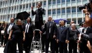 Lawyers and workers in Hong Kong's legal sector gather outside the Department of Justice during a protest in Hong Kong, China August 7, 2019. REUTERS/Thomas Peter