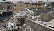 A collapsed building is seen after a suicide car targeted police in the crowded Mirwais Maidan neighborhood during rush hours in Kabul, Afghanistan on 07 August 2019. Haroon Sabawoon - Anadolu 