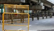 Indian security forces personnel patrol a deserted road during restrictions after the government scrapped special status for Kashmir, in Srinagar August 7, 2019. REUTERS/Danish Ismail