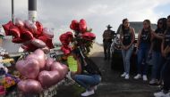 A Horizon High School student mourns for her classmate Jose Rodriguez as people gather to pay their respects four days after a mass shooting at a Walmart store in El Paso, Texas, U.S. August 7, 2019. REUTERS/Callaghan O'Hare