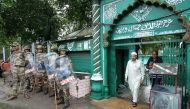 A man leaves a mosque after offering Friday prayers as Indian security force personnel stand guard during restrictions following the scrapping of the special constitutional status for Kashmir by the Indian government, in Jammu August 9, 2019. (REUTERS/Muk