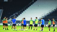Coach Xavi Hernandez (centre) giving instructions to Al Sadd players during a training session in Doha, yesterday, as they prepare for tomorrow’s AFC Champions League Round of 16 second leg match against Al Duhail.