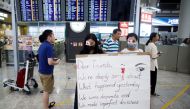 Anti-government demonstrators apologize for yesterday's clashes with police at the airport in Hong Kong China August 14, 2019. (REUTERS/Thomas Peter)