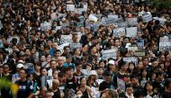 Teachers protest against the extradition bill during a rally organised by Hong Kong Professional Teachers' Union in Hong Kong, China August 17, 2019. REUTERS/Kim Hong-Ji