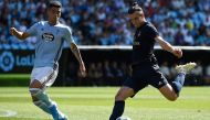 Real Madrid's Welsh forward Gareth Bale (R) challenges Celta Vigo's Uruguayan defender Lucas Olaza during the Spanish League football match between Celta Vigo and Real Madrid at the Balaidos Stadium in Vigo on August 17, 2019. / AFP / MIGUEL RIOPA