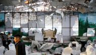 Workers of a wedding hall inspect after a blast in Kabul, Afghanistan August 18, 2019. REUTERS/Mohammad Ismail TPX IMAGES OF THE DAY