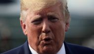 FILE PHOTO: US President Donald Trump speaks to reporters before boarding Air Force One to return to Washington from Morristown Municipal Airport in Morristown, New Jersey U.S. August 18, 2019. REUTERS/Jonathan Ernst/File Photo