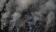 Smoke billows during a fire in an area of the Amazon rainforest near Porto Velho, Rondonia State, Brazil, Brazil August 21, 2019. REUTERS/Ueslei Marcelino