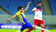 Al Gharafa’s Ahmed Alaaeldin (left) in action against Al Shahania captain Mostafa Jalal Jafri during their opening match of the QNB Stars League at Al Janoub Stadium yesterday. Picture: Twitter/ 
@alkasschannel 
