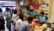 Customers inside a kakigori or shaved ice shop using natural ice in the Yanaka district of Tokyo on June 21, 2019. AFP / Toshifumi Kitamura