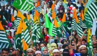 Demonstrators hold flags of Pakistan administered Kashmir during an anti-India protest rally in Karachi on August 25, 2019, in solidarity with India-administered Kashmiri. AFP / Rizwan Tabassum
