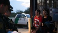 Honduran migrants Diego and Nely stand with three year-old son Diego Jr. after turning themselves in to U.S. Border Patrol agents to seek asylum following an illegal crossing of the Rio Grande in Hidalgo, Texas, U.S., August 23, 2019. REUTERS/Loren Elliot