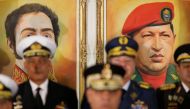 Portraits of Simon Bolivar and Hugo Chavez are seen during a news conference of Minister Vladimir Padrino Lopez in Caracas, Venezuela. January 24, 2019. Reuters/Manaure Quintero