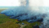 An aerial view shows smoke rising over a deforested plot of the Amazon jungle in Porto Velho, Rondonia State, Brazil, August 27. Picture taken with a drone. Reuters/Ueslei Marcelino