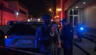 Federal forces keep watch at a crime scene following a deadly attack at a bar by unknown assailants in Coatzacoalcos, Mexico Aug. 28, 2019. Angel Hernandez / Reuters
