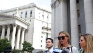 Jennifer Araoz (2nd R), one of deceased financier Jeffrey Epstein's alleged victims, and her attorney Kimberly Lerner (R), speak to the press outside the US Federal Court on August 27, 2019 in New York. AFP / Yana Paskova
 