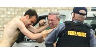 Matthew Thomas Bernard puts his hands on Keeling Baptist Church groundskeeper Loyd Gauldin, as a state police officer attempts to take him into custody on Tuesday, Aug. 27, 2019 in Keeling, Va. (Image courtesy: Caleb Ayers/via heraldmailmedia.com)
