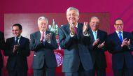 Mexico's President Andres Manuel Lopez Obrador (C), Mexico's Finance Minister Arturo Herrera (L), Federal Electricity Commission (CFE) Manuel Bartlett, Mexican tycoon Carlos Slim (2nd R) and Business Coordinating Council (CCE) Carlos Salazar applaud after