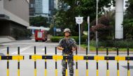 A Chinese People's Liberation Army (PLA) soldier guards the entrance to the PLA Hong Kong Garrison headquarters in the Central Business District in Hong Kong, China, August 29, 2019. REUTERS/Anushree Fadnavis