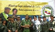 This TV grab taken from youtube and released on August 29, 2019 shows former senior commander Ivan Marquez(C) and fugitive rebel colleague, Jesus Santrich(wearing sunglass), of the dissolved FARC rebel army group in Colombia, on an undisclosed location of