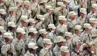 In this file photo taken on September 11, 2002, US soldiers salute during a flag lowering ceremony at the Bagram Air Base. AFP / Desha-Kalyan Chowdhury 