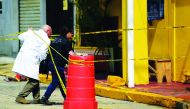 Forensic technicians of the Mexico's Attorney General's office (FGR) enter 