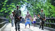 Security personnel patrol on a road ahead of the publication of the final draft of the National Register of Citizens (NRC) at Kachari Para village, in Hojai district, Assam, August 30, 2019. Reuters/Anuwar Hazarika