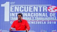 Handout photo released by the Venezuelan Presidency showing Venezuelan President Nicolas Maduro speaking during the 1st International Meeting of Workers in Caracas, on August 30, 2019.   AFP 