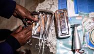 A woman practicing illegal abortion shows her working medical tools in her living room on July 25, 2019 in Antananarivo.  AFP / Gianluigi Guercia 