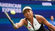 Naomi Osaka of Japan returns a shot against Belinda Bencic of Switzerland during their Round Four Women's Singles match at the 2019 US Open at the USTA Billie Jean King National Tennis Center in New York on September 2, 2019. / AFP / Kena Betancur 