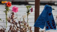 Flowers are seen at a makeshift memorial near Truth Aquatics as the search continues for those missing in a pre-dawn fire that sank a commercial diving boat off a Southern California island near Santa Barbara, California, U.S., September 2, 2019. REUTERS/