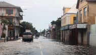 View of a flooded street in downtown Nassau on September 3, 2019. AFP / Lucy WORBOYS