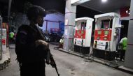 Police Mobile Brigade (Brimob) officer stands guard at a gas station in Jayapura, Papua, August 31, 2019 in this photo taken by Antara Foto. Zabur Karuru/ via Reuters