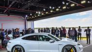The Porsche Taycan electric car is presented to the public as a world premiere on September 4, 2019 in a hall of the airfield of Neuhardenberg, eastern Germany.  AFP / DPA / Patrick Pleul 