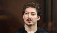 Russian anti-government activist, student Kirill Zhukov, stands inside the defendants' box during a hearing at a court in Moscow on September 4, 2019. AFP / Kirill Kudryavtsev
 