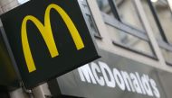 This file photo taken on January 22 2014 in Paris shows the logo of a US fast food restaurant McDonald’s . AFP / Kenzo Tribouillard