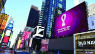 The official 2022 FIFA World Cup Qatar emblem flashes on an electronic billboard at Time Square in New York City on Tuesday