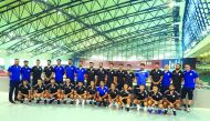 Afghanistan national football team players and officials pose for a photograph during their visit to Doha’s Aspire Academy.