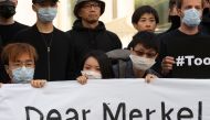 Protesters hold a vigil for democracy in Hong Kong in front of the Chancellery in Berlin on September 5, 2019. AFP / DPA / Paul Zinken 