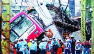 A train is seen derailed after a collision with a truck at a crossing in Yokohama, Kanagawa Prefecture on September 5, 2019. AFP / Kazuhiro Nogi