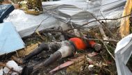  The corpse of a man is seen at the Mudd neighborhood, devastated after Hurricane Dorian hit the Abaco Islands in Marsh Harbour, Bahamas, September 6, 2019. Reuters/Marco Bello