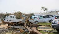 Damaged cars and trucks sit in a field following landfall by Hurricane Dorian, in Treasure Cay, Bahamas September 4, 2019. Seaman Erik Villa Rodriguez/US Coast Guard/ via Reuters