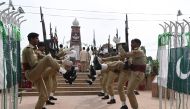 Pakistani soldiers pay tribute at a war monument to celebrate Defence Day, which marks the anniversary of the country's second war with India between August and September 1965 with both sides claiming victory after it ended in a stalemate, near Wagah bord