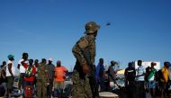 A soldier stands guard at Marsh Harbour Government Port during an evacuation operation after Hurricane Dorian hit the Abaco Islands in Marsh Harbour, Bahamas, September 6, 2019. REUTERS/Marco Bello